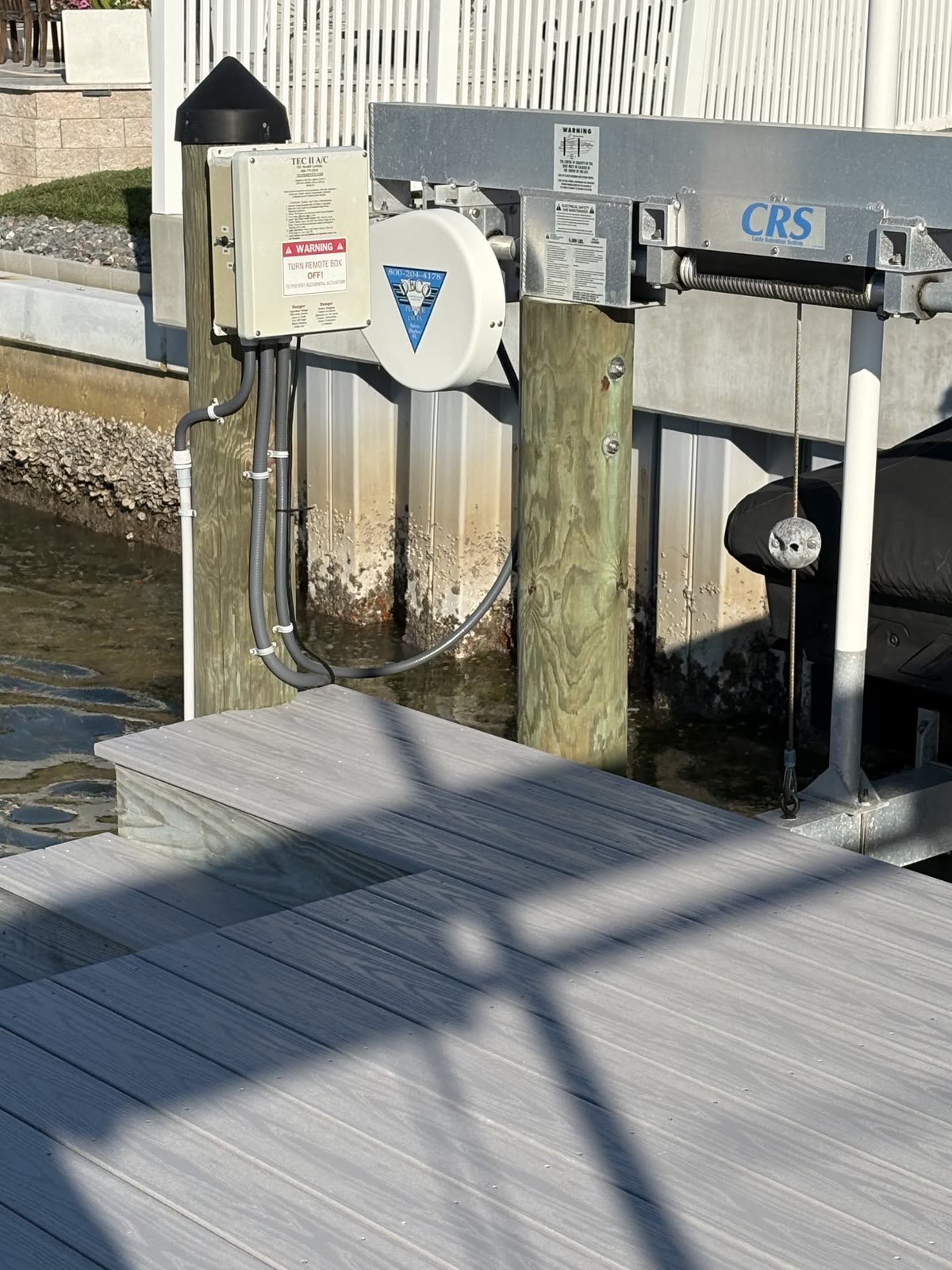 Weatherproof boat lift control box mounted on a dock piling in Clearwater, FL