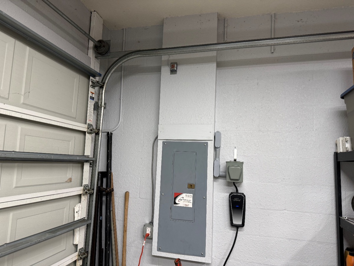 Level 2 EV charger installed in a residential garage by Brightwire Electric