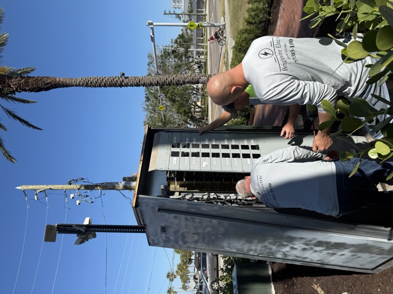 Brightwire Electric team working on an outdoor electrical panel installation in Florida